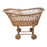 Rattan cradle for doll on vintage wheels