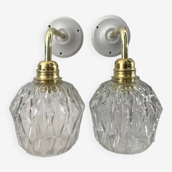 Pair of chiseled glass sconces