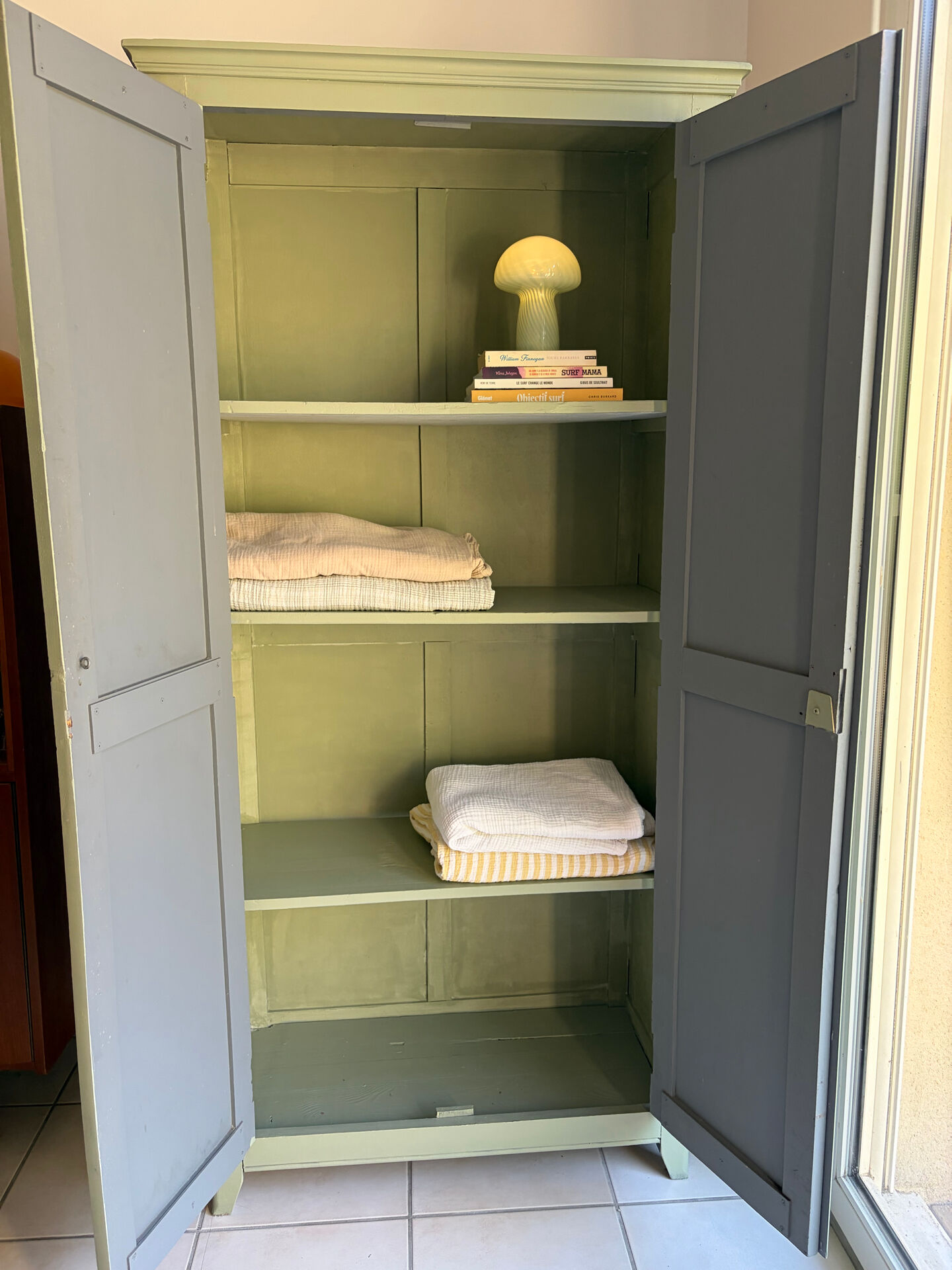 Antique Parisian wardrobe in sage green patina