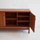 Modern mid-century teak sideboard with brass details.