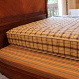 Walnut rocaille bed from the early 20th century.