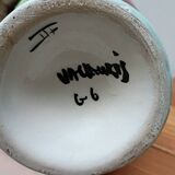 Vallauris vase flowers on black background