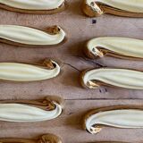 Set of 12 vintage art deco yellow and gold ceramic knife rests
