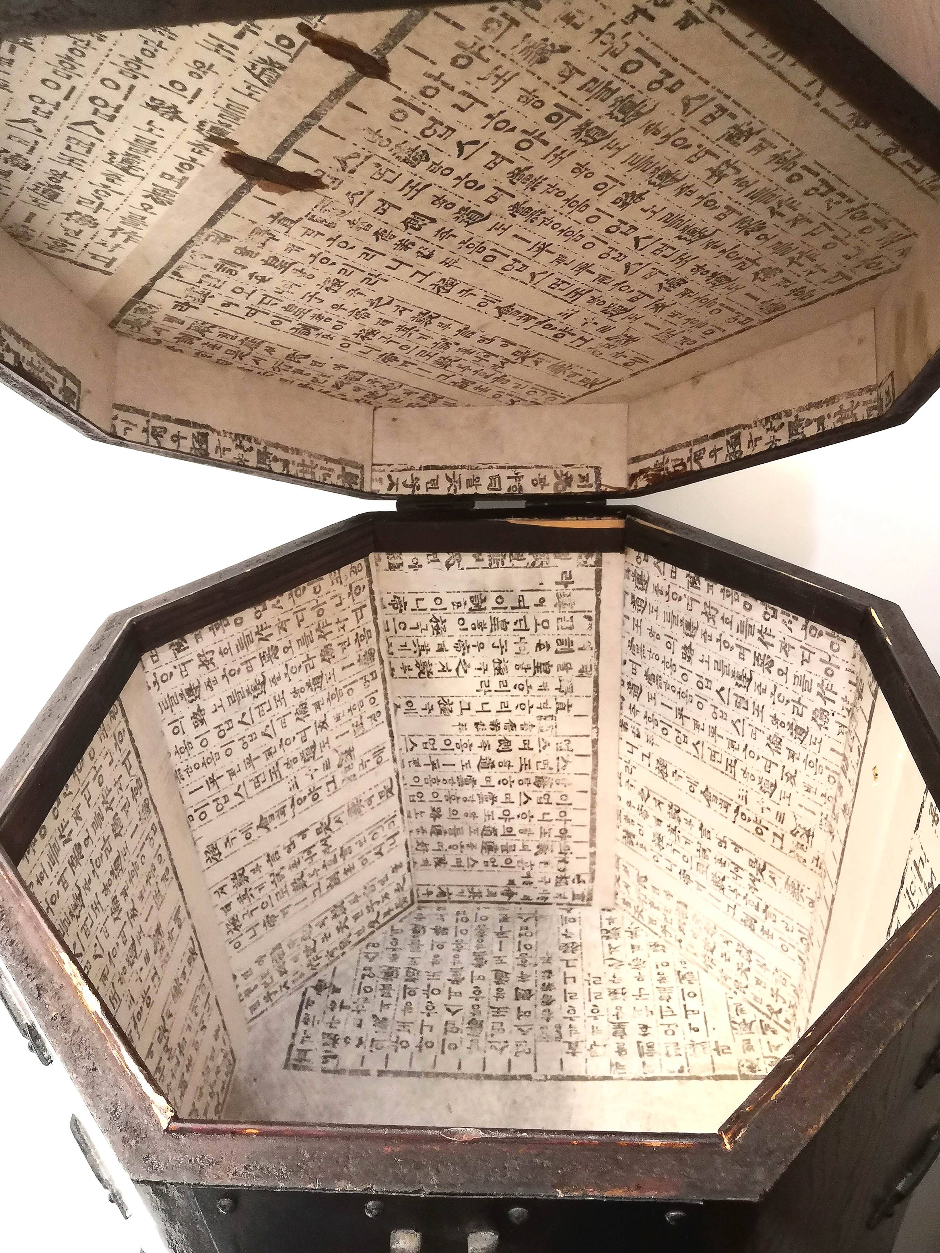Octagonal wooden chest with metal ornaments from Asia