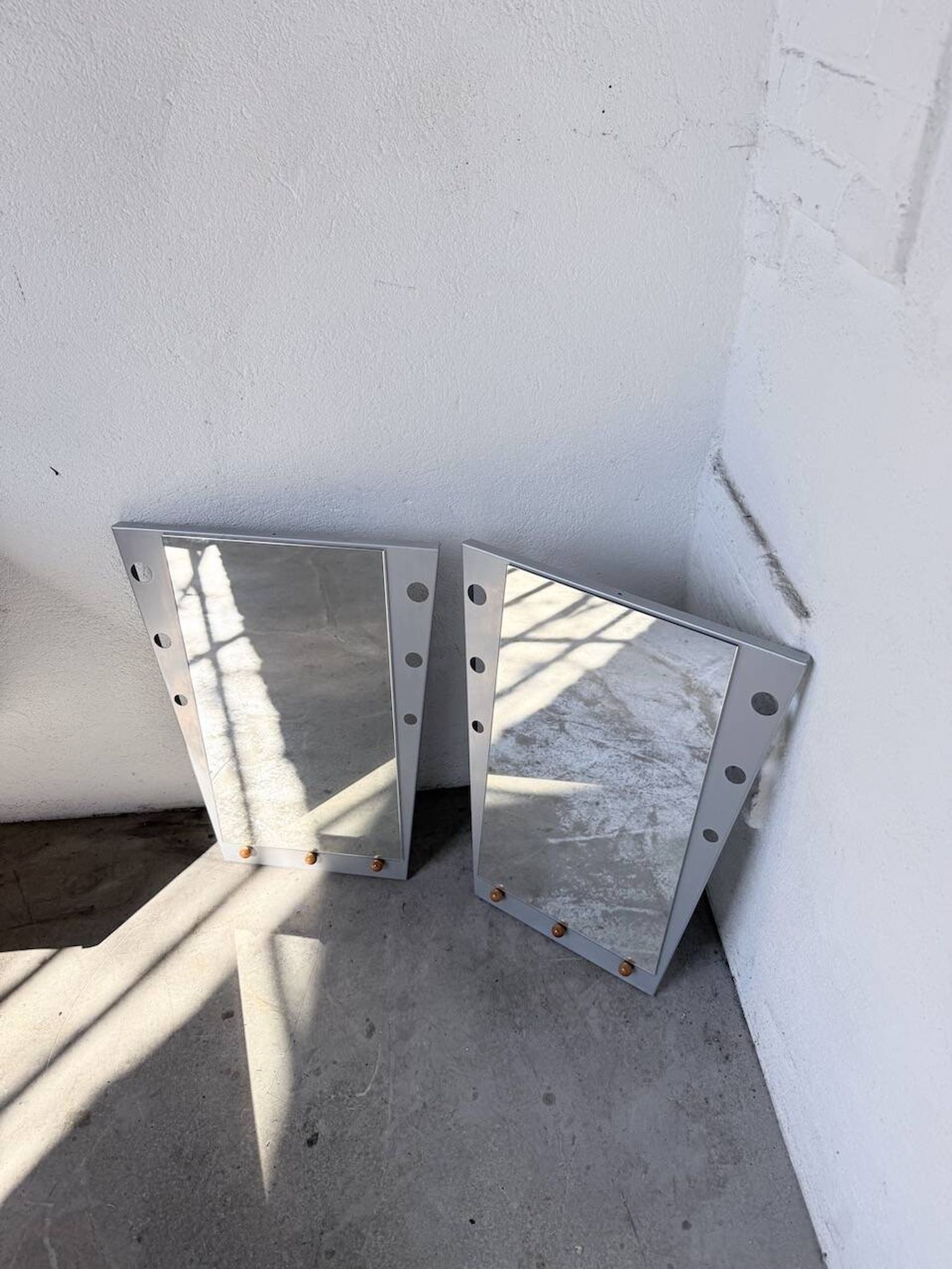 Pair of "Memphis" mirrors from the 80s in chrome and wood.