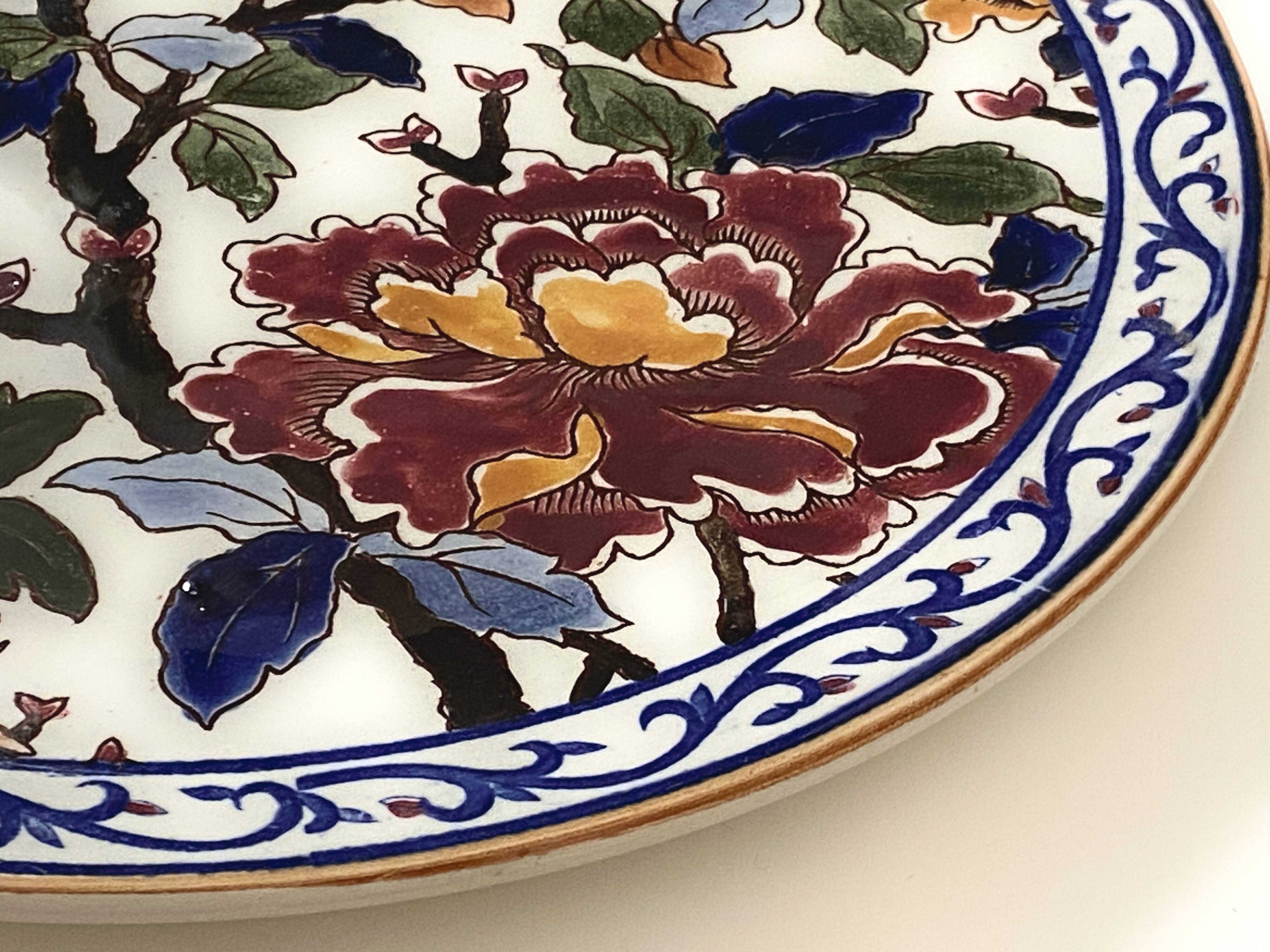 Round plate in Gien earthenware model Peonies