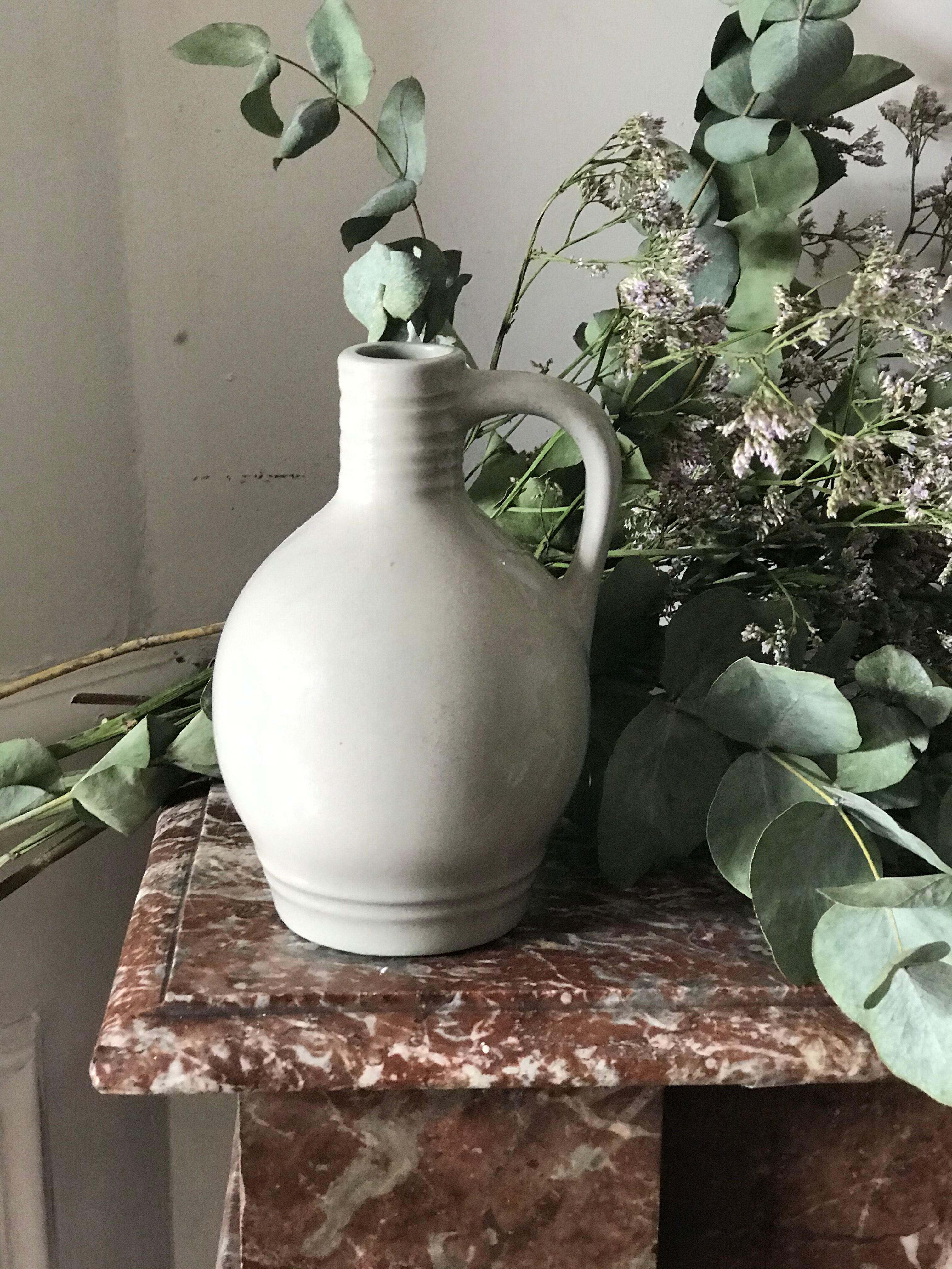 Pitcher with ceramic handle