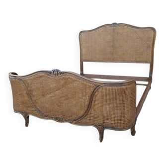 Lit with caned basket in Louis XV style.