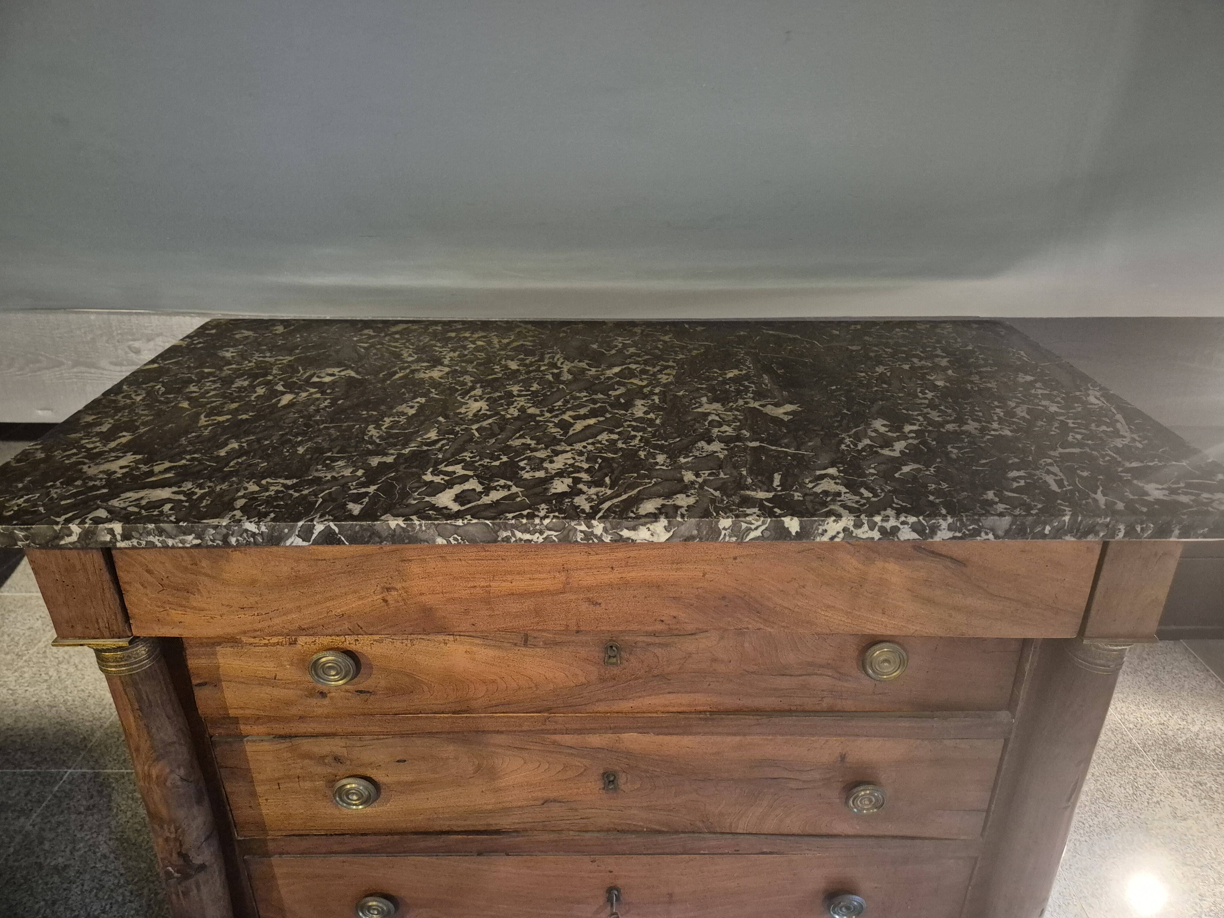 Empire period walnut chest of drawers