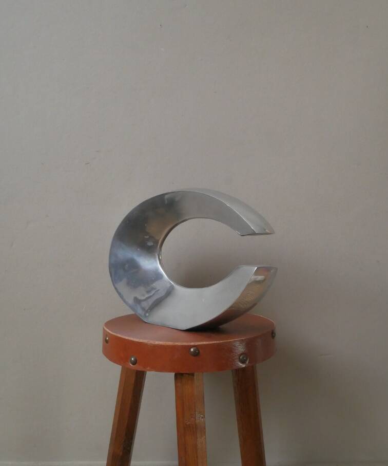 Single-flower vase in cast aluminum, space age design, silver metal