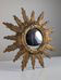 Convex sunburst mirror in carved and gilded wood, 1950s