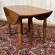 Round cherry wood table, 6 feet, Louis Philippe style with 2 extensions.