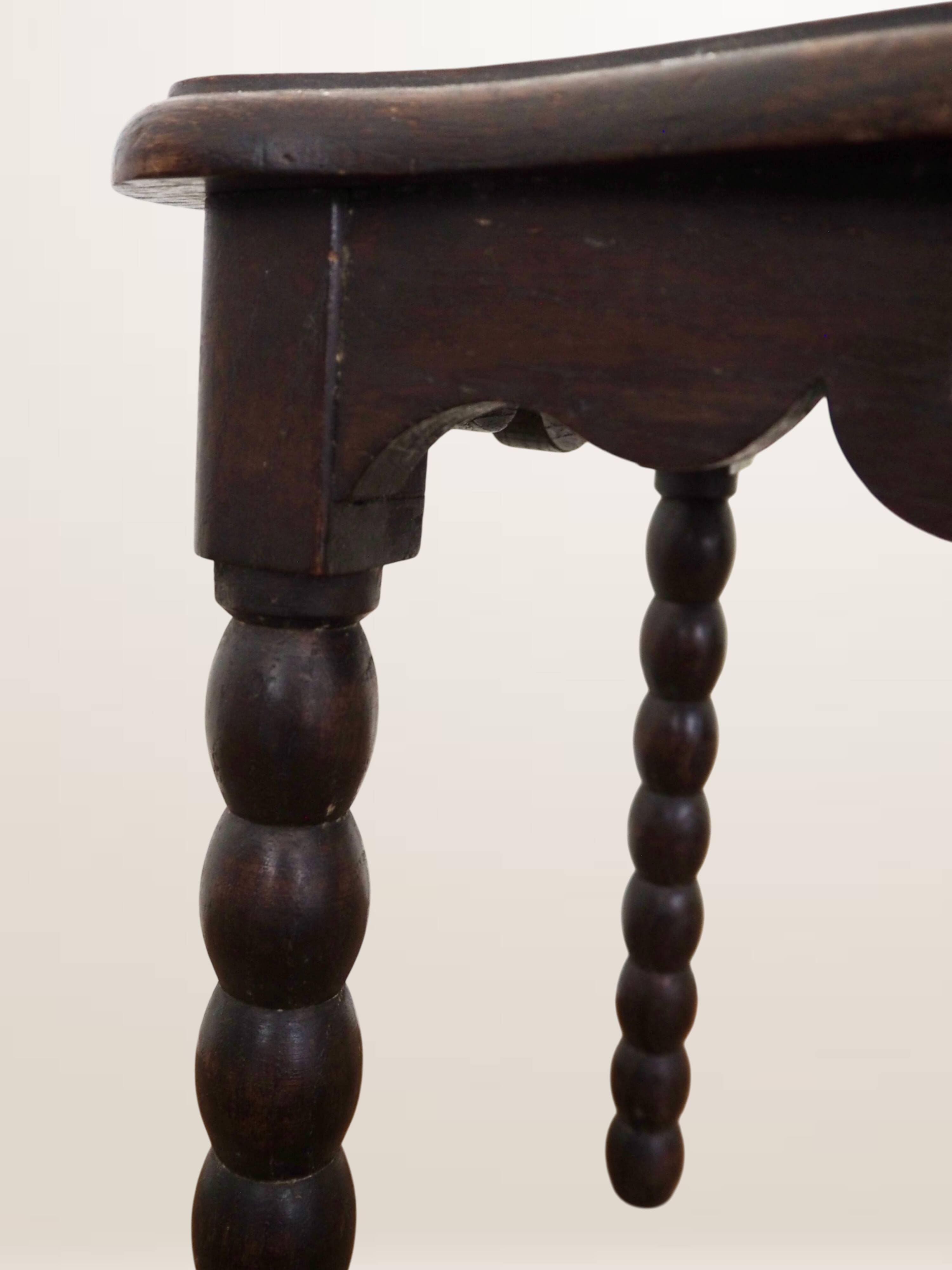 Oak stool with beaded spool legs