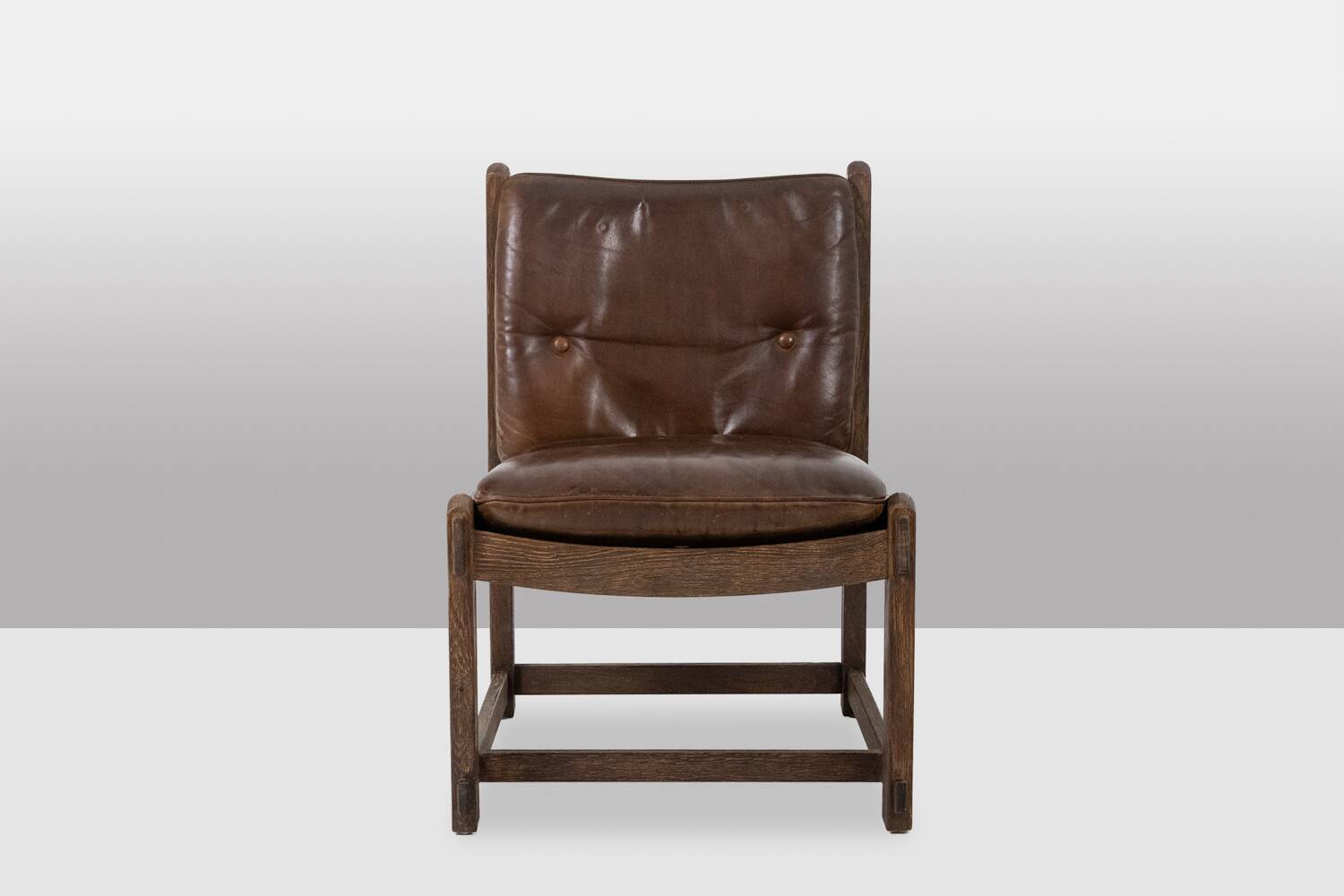 Pair of oak armchairs, upholstered in leather. Work from the 1960s.