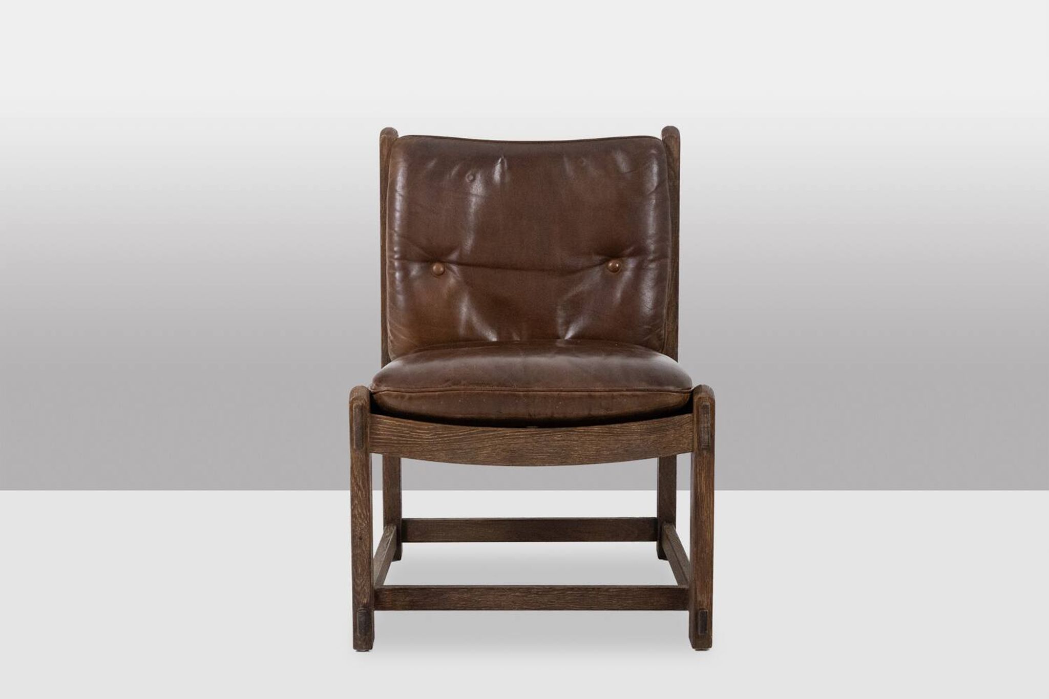 Pair of oak armchairs, upholstered in leather. Work from the 1960s.