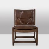 Pair of oak armchairs, upholstered in leather. Work from the 1960s.