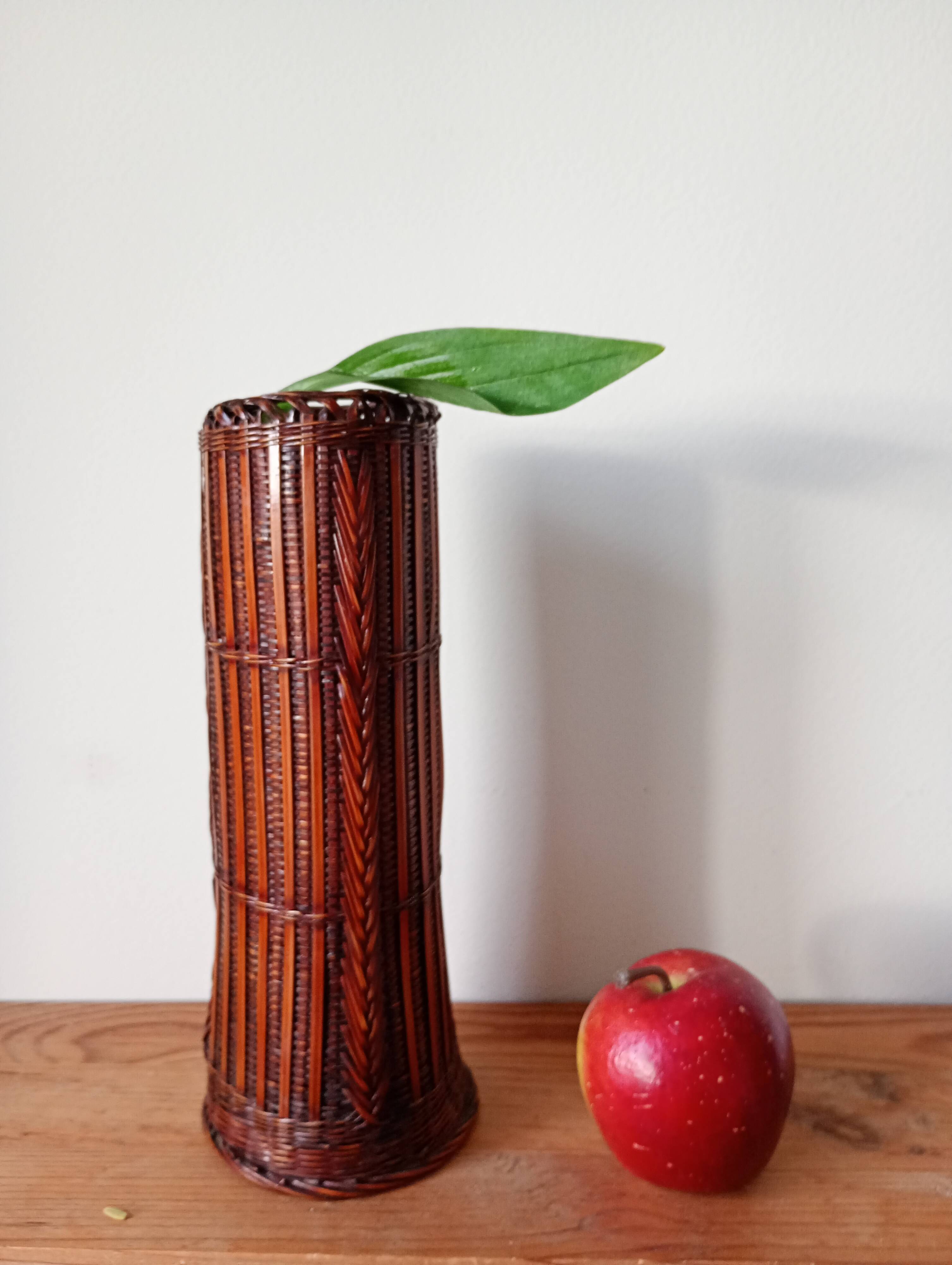 Japanese vase made of woven bamboo. Ikebana