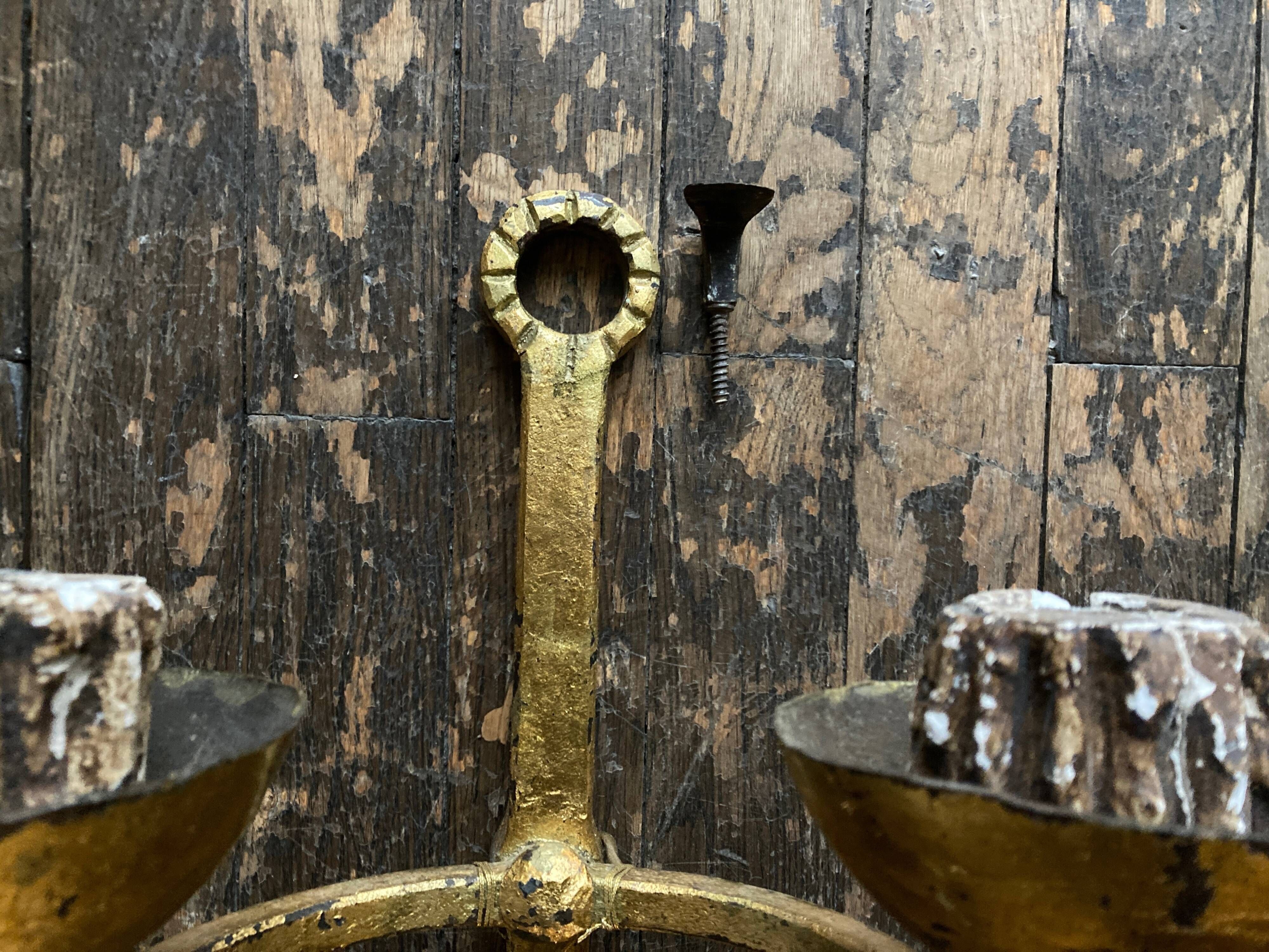 Pair of XXL torchlight sconces in golden beaten iron Italian work 1960
