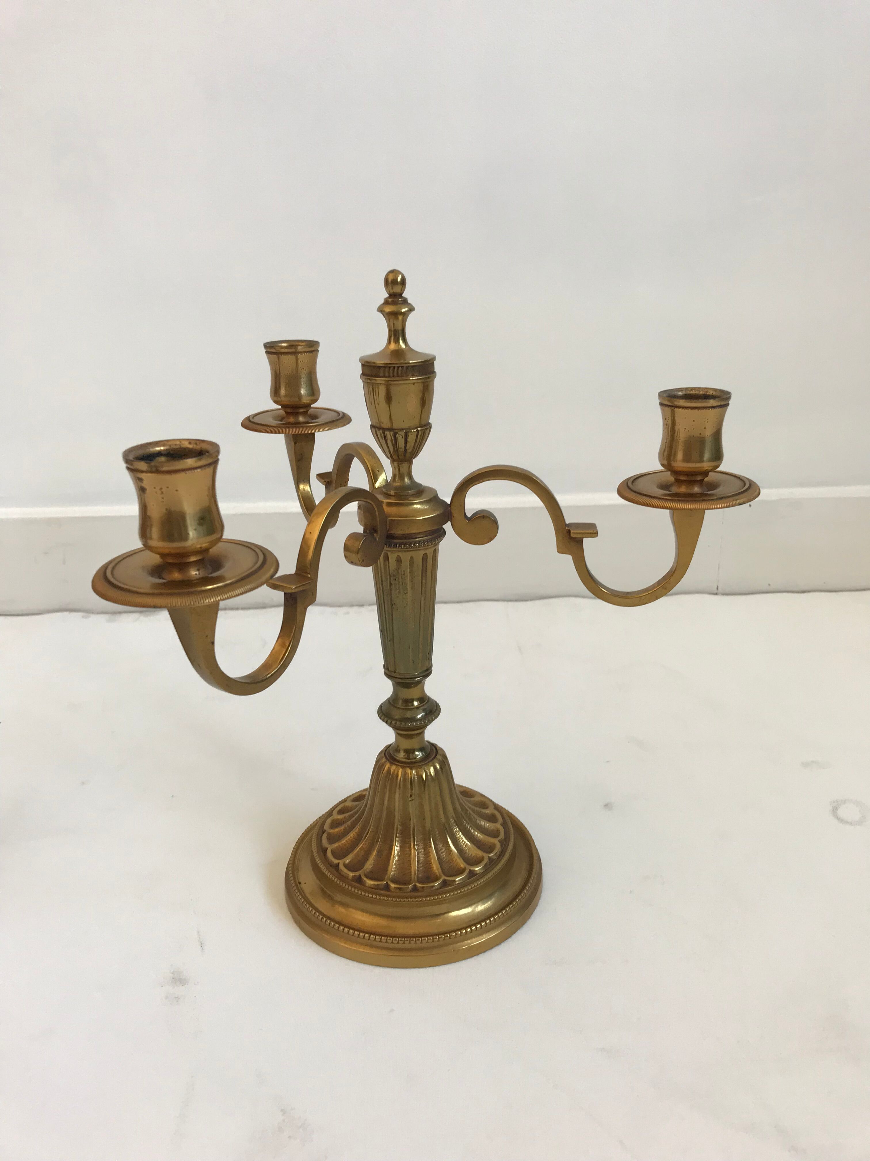 Pair of golden brass candlesticks