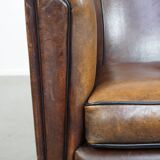 Sheep leather club chair finished with black piping