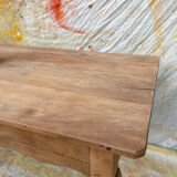 Curved farmhouse table in rustic wood, Provençal style.