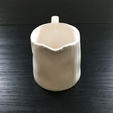 White pitcher streaked in relief