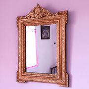 Napoleon III mirror with rich gilded ornamentation