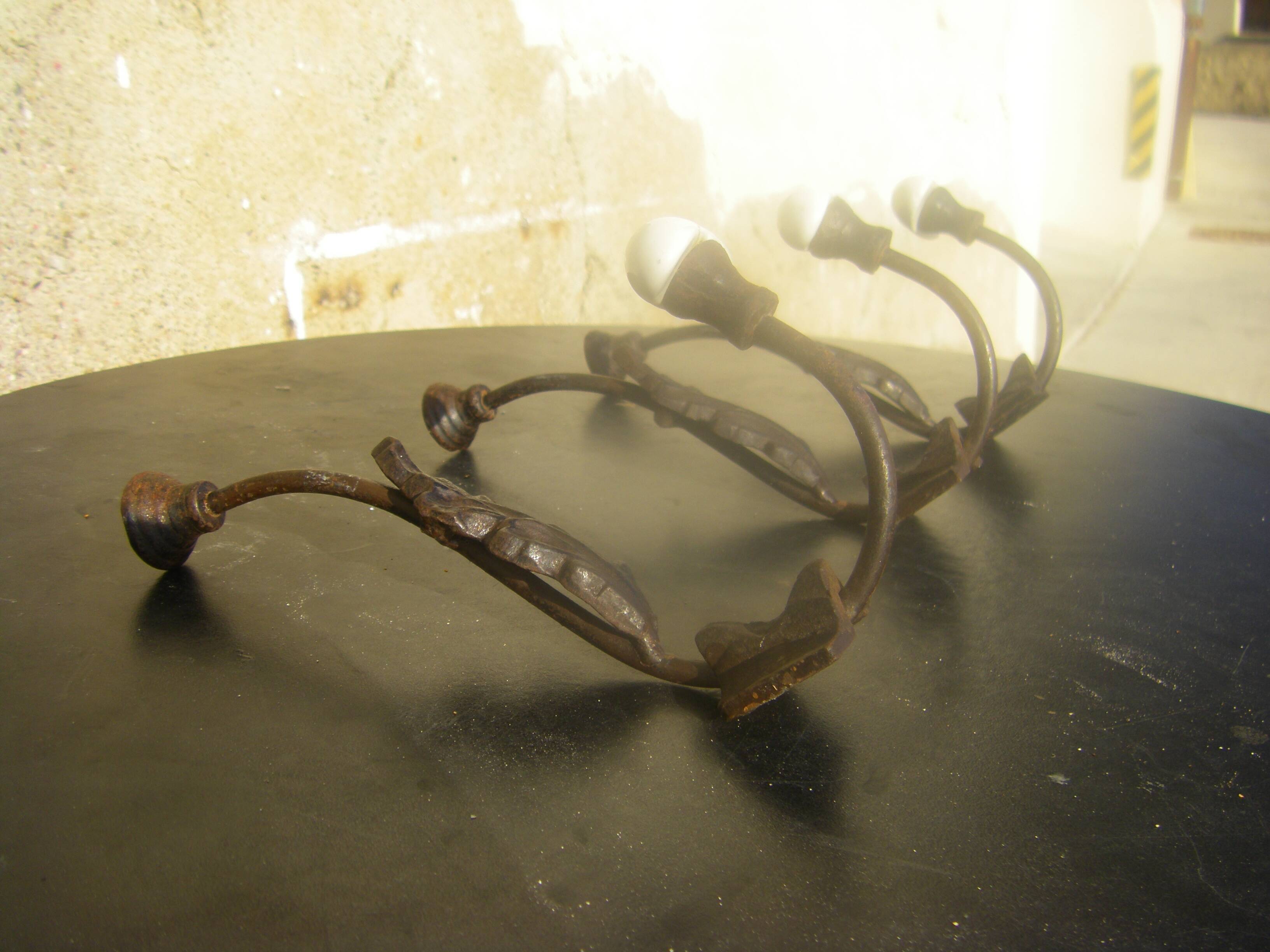 Trio of vintage coat hooks.