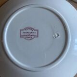 A series of eight flat plates in Terre de fer earthenware, Favori aux oiseaux model - pink tint