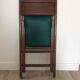 Chaise pliante en bois et skaï vert