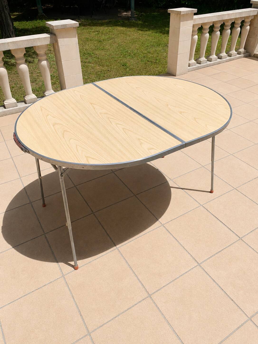Folding oval table - height adjustable - metal and laminate - 60s/70s.