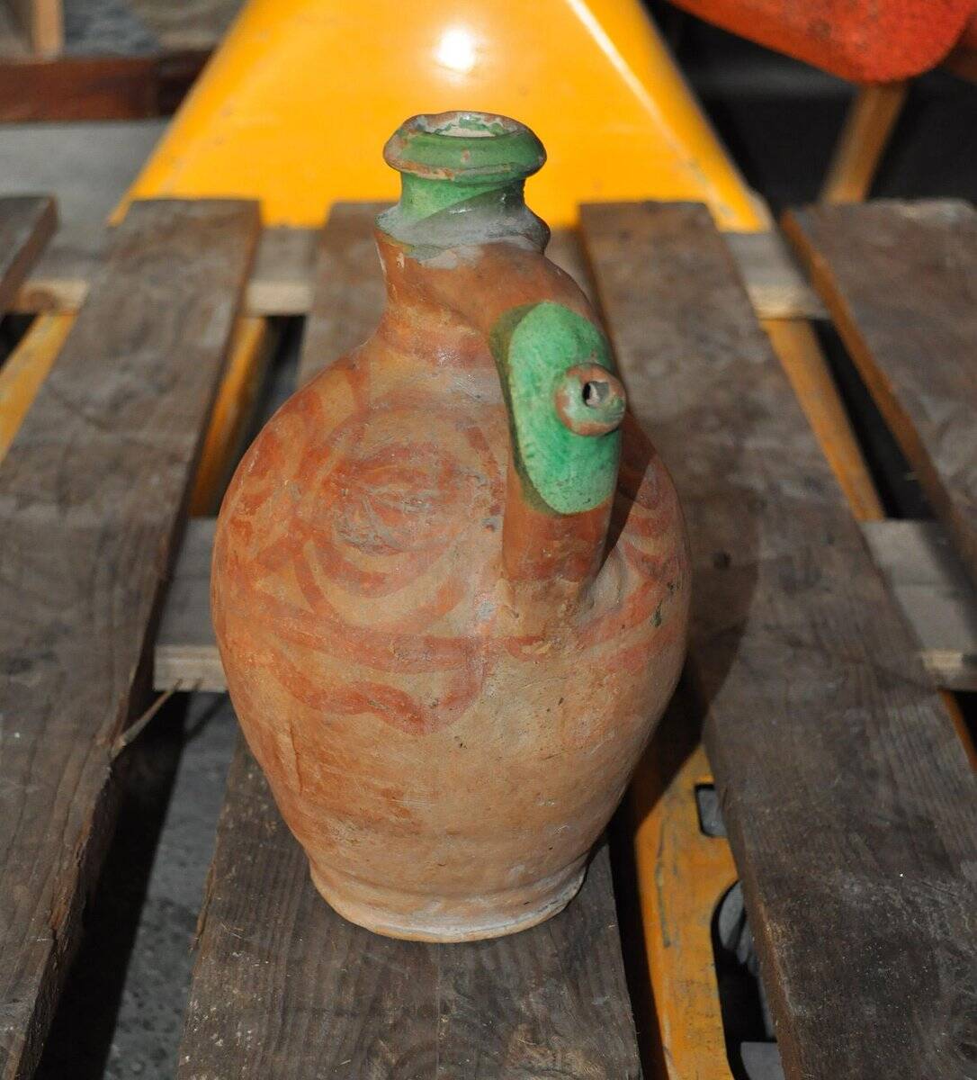 Antique red and green terracotta carafe, rustic Hungarian jug from the 1920s.