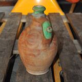 Antique red and green terracotta carafe, rustic Hungarian jug from the 1920s.