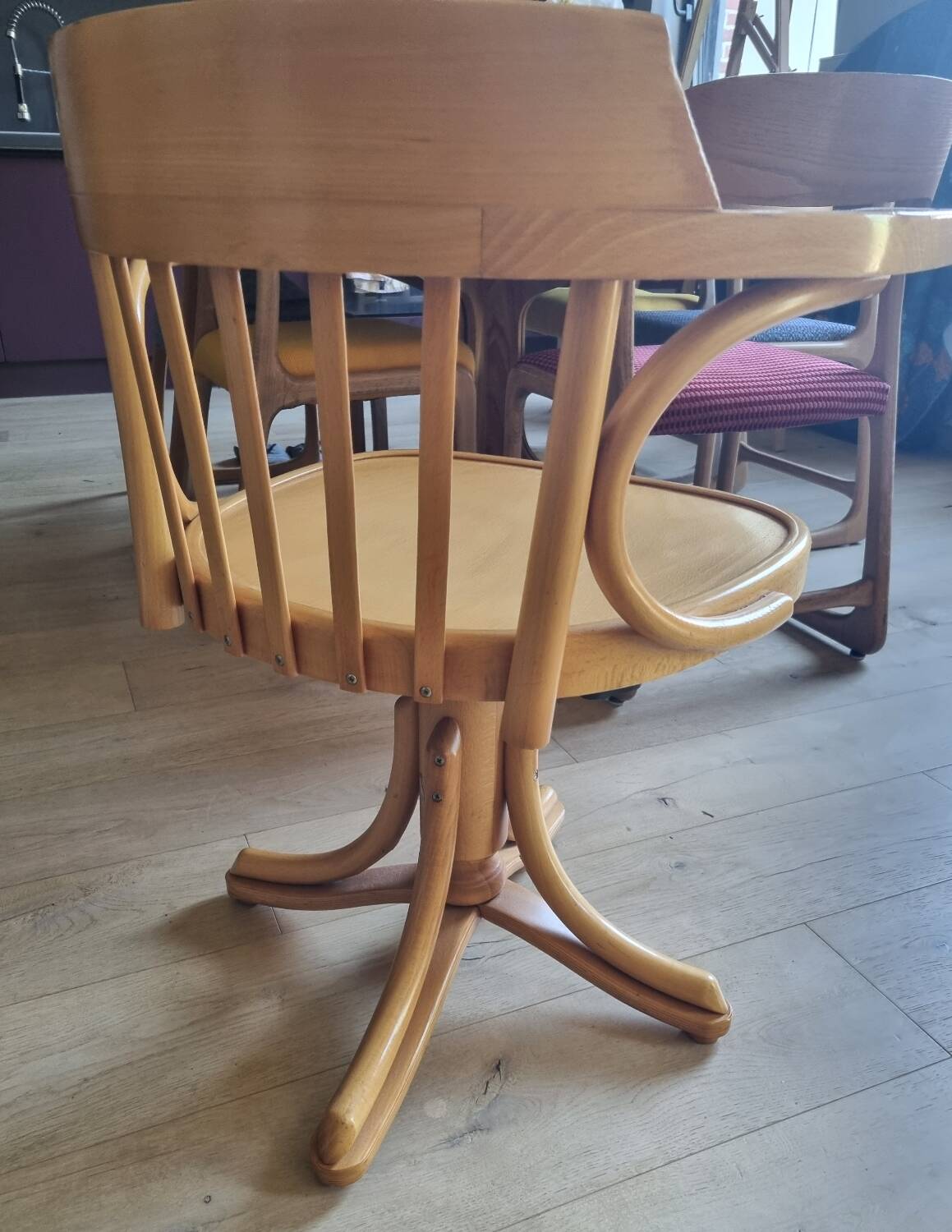 Wooden swivel armchair