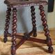 Antique stool in turned and carved solid wood