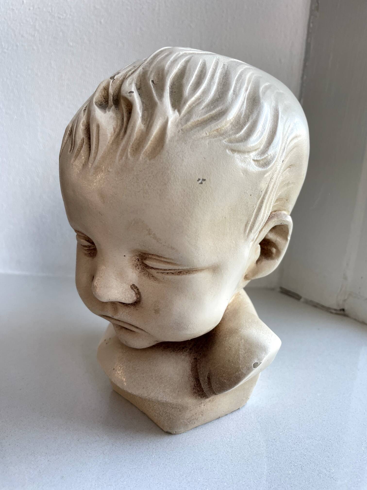 Child bust made from resin by Antoine Paridon, signed 240 A.P.