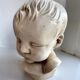 Child bust made from resin by Antoine Paridon, signed 240 A.P.