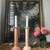 Pair of vintage salmon pink candlestick shaped ceramic lamp bases