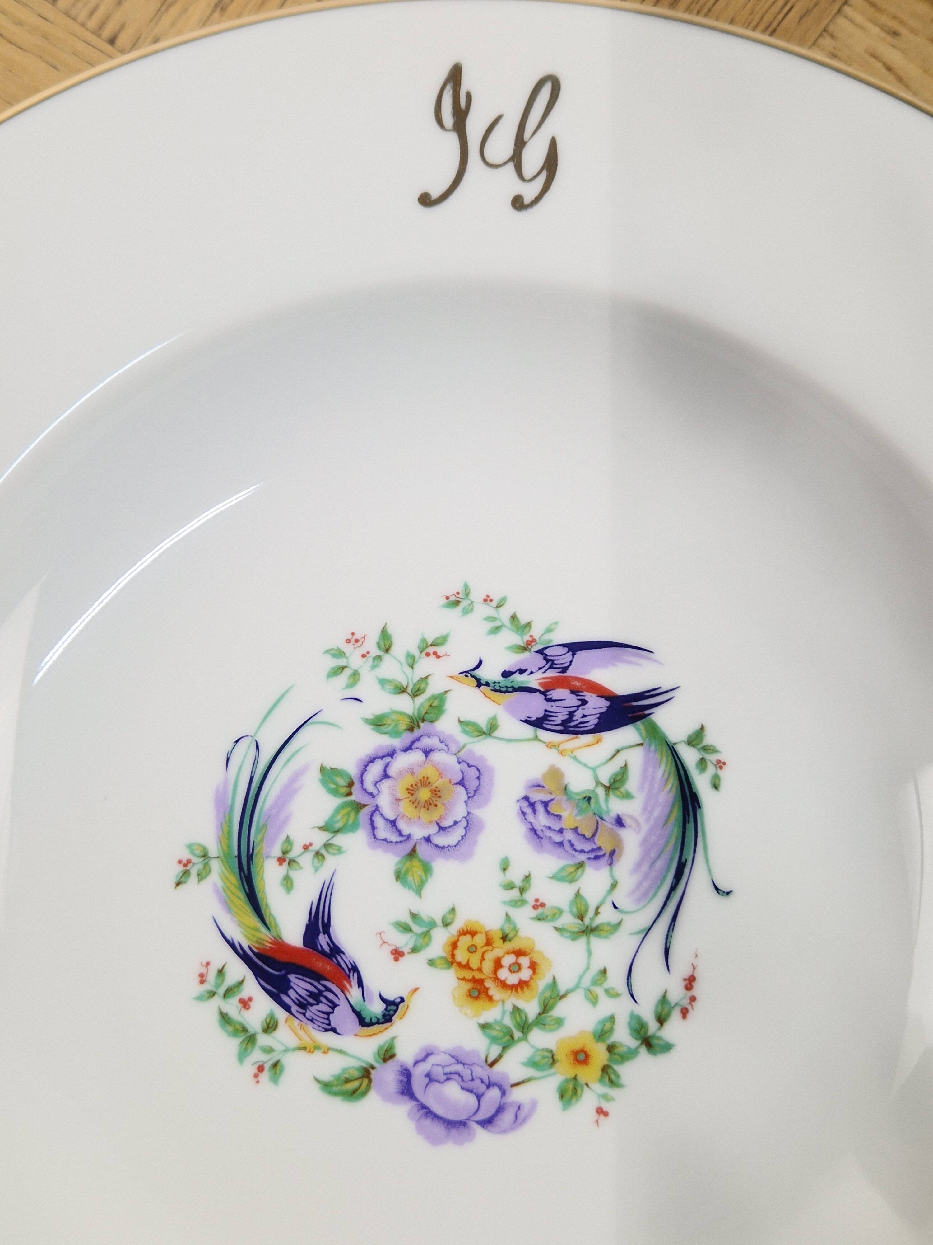 6 deep plates made of Limoges porcelain with a paradise bird design.