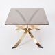 Gold Colored Mid-Century Modern coffee table with smoked Glass top