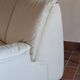 Cinna armchair in cream leather, bolstered armrests, 1970s.