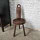 Antique tripod chair in solid wood and animal skin.
