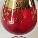 Vase in the shape of a footed cup, in bohemian crystal. ruby color. scroll & floral design with 24 c gold highlights