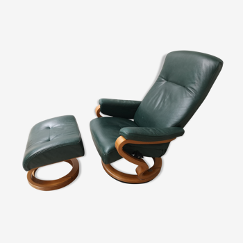 Mid - century leather armchair with footrest with relax function from himolla