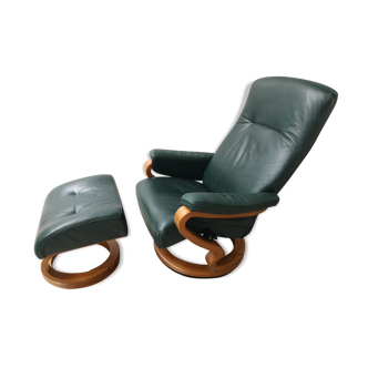 Mid - century leather armchair with footrest with relax function from himolla