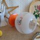 Retro orange table lamp and 70s glass globe