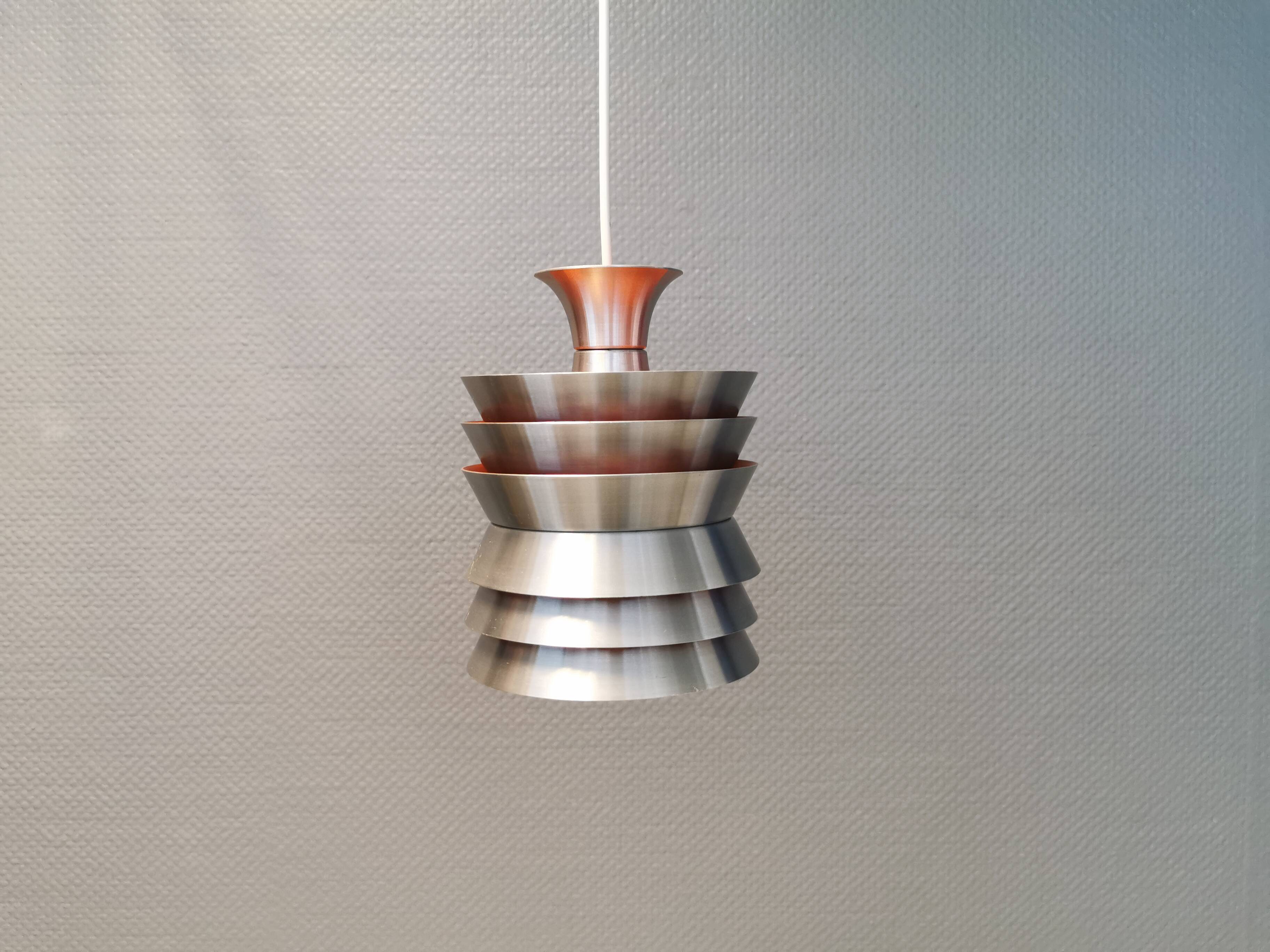 Danish/Swedish hanging lamp, in silver-coloured aluminium with orange interior paint.