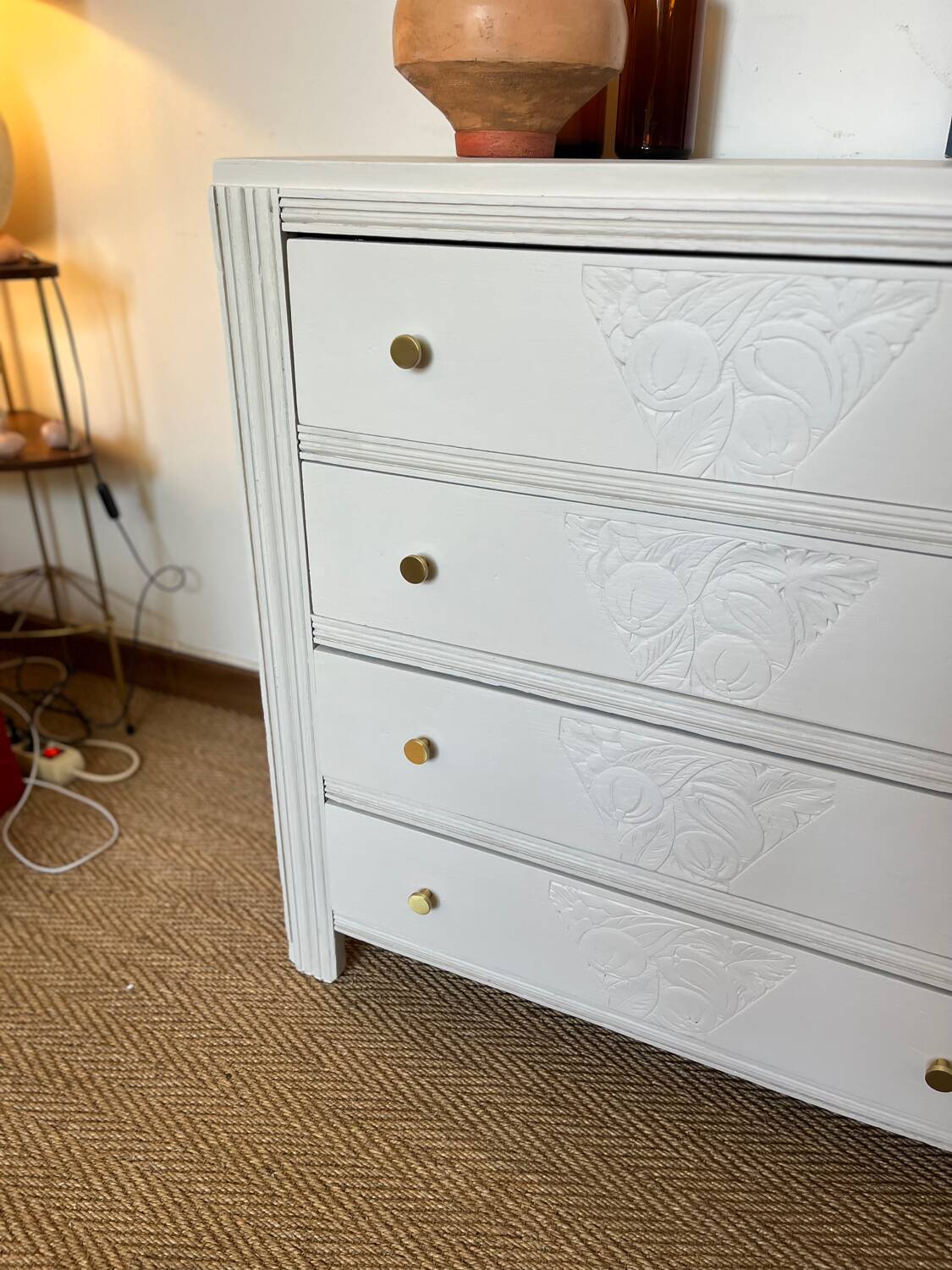 Restored wooden art deco chest of drawers with gilded handles