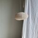 Average suspension in natural rattan and linen, Japanese-style, flattened oval in pink.