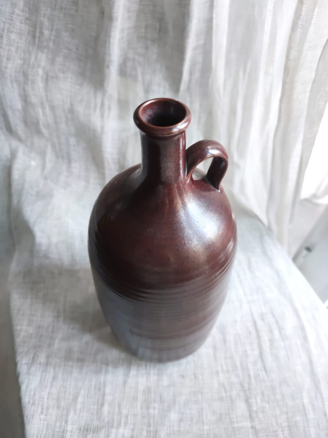 Large burgundy jar